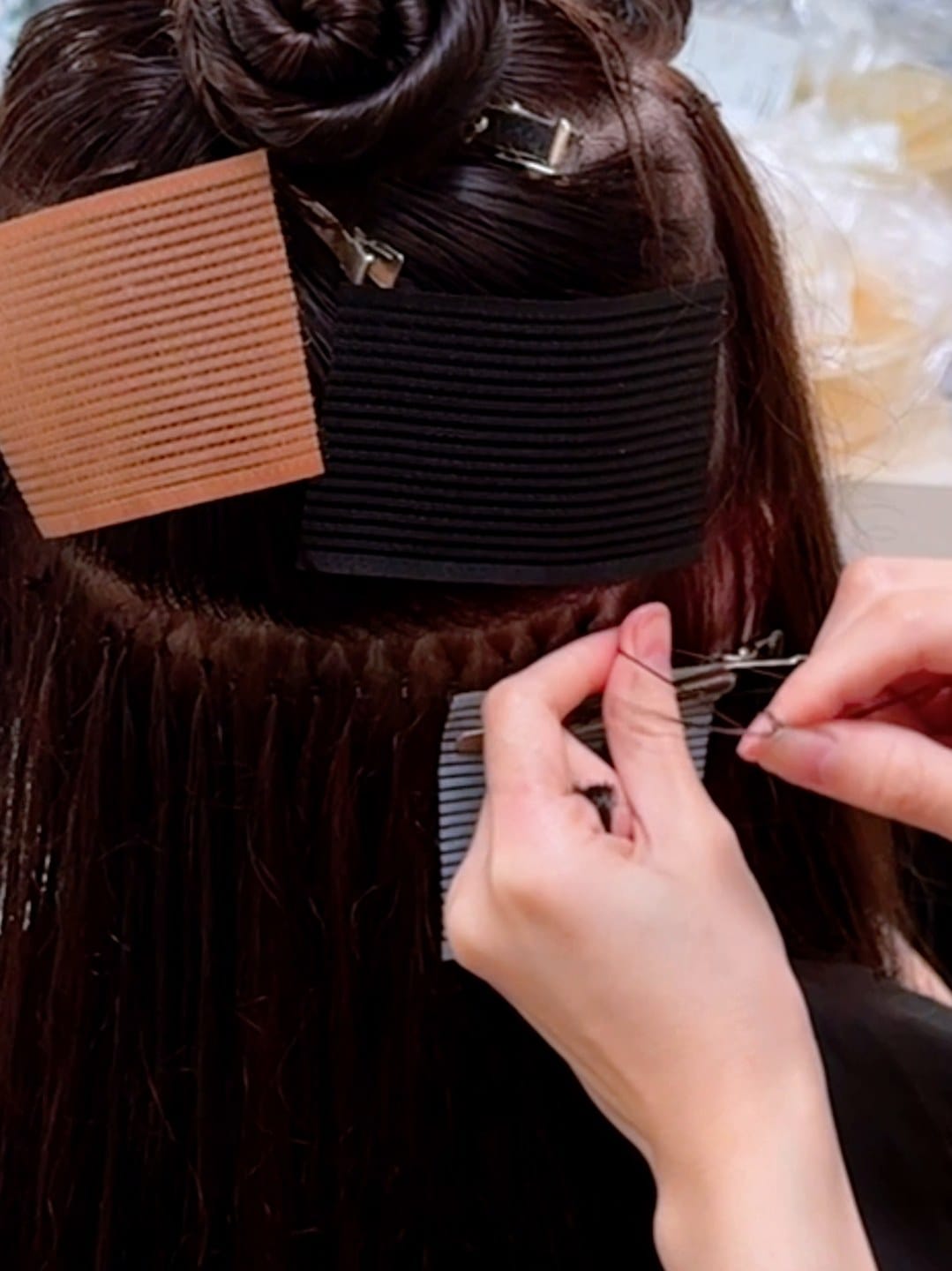 Hair extensions for added length and volume, back view, before