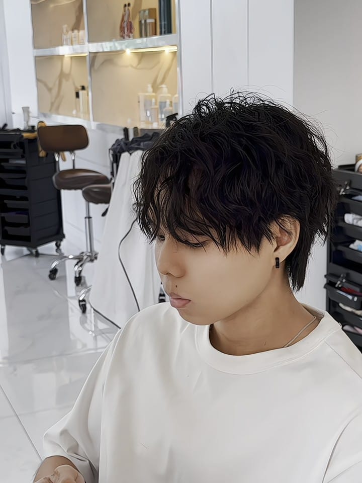 Men's perm with textured curls, side view at Minus Over Hair Studio, after